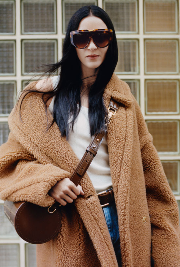 a woman wearing sunglasses and a coat from Max Mara