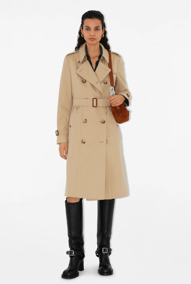 a woman in a burberry trench coat 